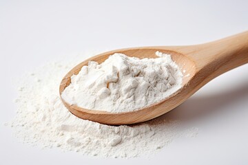 Wall Mural - Flour in wooden spoon on white background