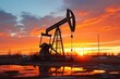 © Alina Zavhorodnii - Oil production tower against the backdrop of the sunset
