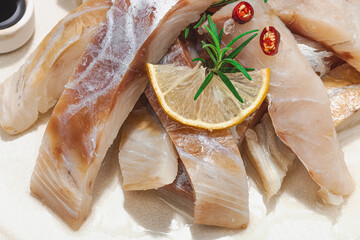 Wall Mural - Raw pollock (Pollachius virens) fillet. Fresh fish for healthy food lifestyle. Spices and herbs