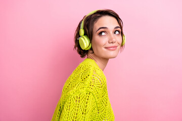 Poster - Photo portrait of youngster lovely girlfriend enjoy relaxing music in green headphones look novelty isolated on pink color background