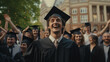 © theevening - Happy male student in a black square cap and gown on graduation day.