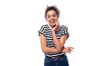 © Ivan Traimak - young positive curly brunette woman in a black and white striped casual t-shirt