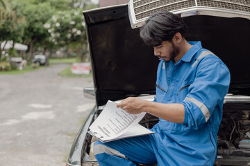 car engine service concept Car mechanic checks car engine with car repair inspection, car service and maintenance, checks oil in car engine.