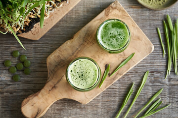 Wall Mural - Barley grass juice with fresh homegrown barleygrass blades, powder and tablets