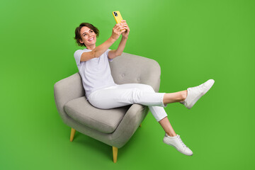 Wall Mural - Full length photo of dreamy sweet girl dressed grey polo tacking selfie modern device isolated green color background