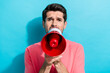 Portrait of young angry man demonstration screaming holding megaphone staring announce new event isolated on aquamarine color background