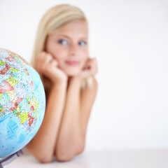 Sticker - Globe, earth and a woman thinking about travel in studio on a blurry white background for freedom. Planet, map or atlas and a tourist with an idea for a holiday or vacation destination on the world