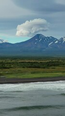 Wall Mural - aerial view of khalaktyrsky beach with black sand and volcano on kamchatka peninsula, russia, pacifi