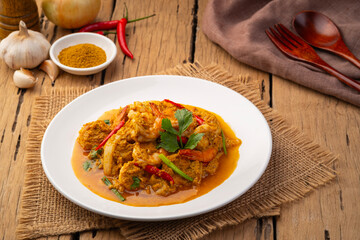 Wall Mural - Stir Fried Shrimp with Curry Powder in white plate ,(goong pad pong karee),Thai Food.