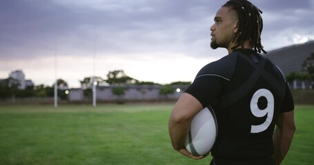 Wall Mural - Man, back and outdoor with rugby ball, sports and vision for training, professional and dark sky for game strategy. Person, athlete and thinking on field, exercise or fitness for competition on grass