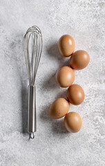 Canvas Print - brown eggs and whisk