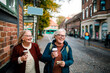 © Davor - Two senior women looking for direction in the city