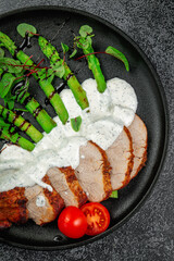 Wall Mural - Roasted green asparagus with sliced beef meat in layers