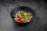 Fototapeta Kuchnia - Caesar salad with croutons, cherry tomatoes, olives, cucumber and red onion