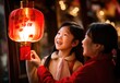 Young little chinese girl hold traditional lantern for a new year eve 2024