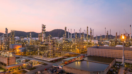 Wall Mural - Oil and gas industrial refinery at twilight, Oil refinery and Petrochemical plant pipeline steel, Refinery factory oil storage tank and pipeline steel at night.