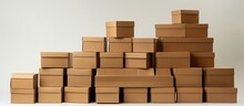 Brown Stacked Cardboard Boxes On White.