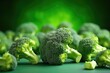 Fresh green broccoli on green background, closeup. Healthy food concept.