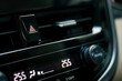 close-up of car dashboard, hazard flasher switch or emergency light button in modern car, shallow depth of field