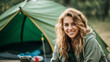 Portrait of happy captivating young woman enjoying camping in a beautiful outdoor landscape with natural lighting