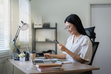 Woman on desk with smartphone, credit card and ecommerce payment for online shopping at home. Happy female customer, digital bank app and sale on store website with internet banking