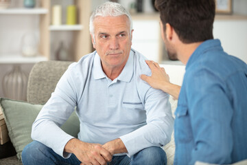 aged man depressed have friends encouraging him