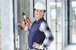 © auremar - woman using some power tools for work at home