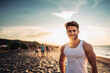 attractive young adult man on sandy beach, toned muscular body, muscles, friendly smile, handsome man