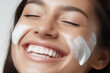 Skin care concept - drop of anti-aging cream on latino female's cheekbone. Perfect, flawless skin. 