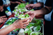 © kuarmungadd - concept of charity food for the poor : the concept of life problems, hunger in society : Helping People With Hunger With Kindness : The hands of beggars receive donated food