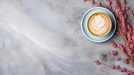 Wall Mural - Light blue cup of cappuccino from above with latte art, dried pink leaves and grasses, on a slate stone, coffee beans, isolated on a white background.