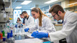 © AspctStyle - Group of student working in advanced lab with science equipment