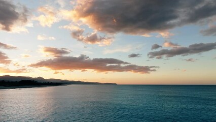 Wall Mural - Celestial Clouds moving on calm sea surface 