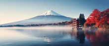 Vibrant Autumn Scenery: Mount Fuji, Morning Fog, And Red Leaves By Lake Kawaguchiko