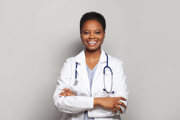 Wall Mural - Confident female doctor medical worker on white background