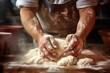 close-up shot of hands kneading dough in a bakery