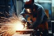 Worker grinding in a workshop.