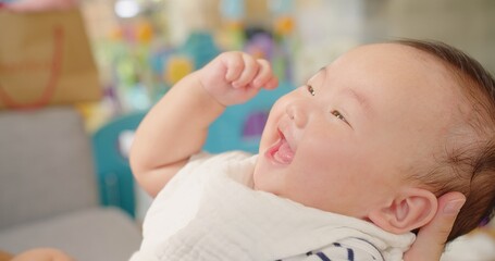 Poster - Happy Mother and baby playing bonding activity together in living room. little cute Asian baby infant child girl excited laughing and fun spend quality time, Family having fun at home