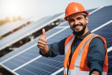 Satisfied Worker Showing Thumbs Up Gesture While Standing Near Solar Panels At Power Plant