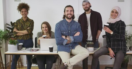 Wall Mural - Business people, face and smile with confidence in office, solidarity and unity at workplace. Teamwork, coworkers and happy in portrait for collaboration and drinking coffee, support and meeting