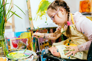 color painting for kids, child with down syndrome, development of children with special needs. funny