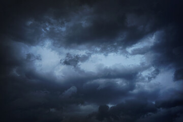 Wall Mural - black dark blue gray sky with heavy clouds. dramatic background. storm hurricane wind rain cloudy. o