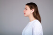 © Volodymyr - Woman listening to music with earphones. Girl with headphones, wireless earphones. Listening music in earphone, studio. Earphones in ear. Woman using headphones. Ear buds, wireless earbud earphone.