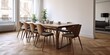 © Lasvu - Modern apartment with empty chairs arranged on parquet floor around large wooden table in dining room