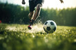 soccer player kicking a soccer ball in the field