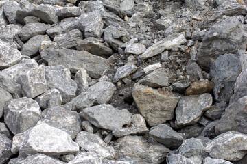 the wall of a mountain canyon made of natural material, stone - limestone material of volcanic origin, close-up.