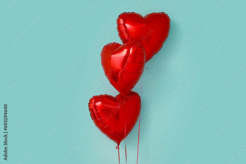 Heart shaped air balloons on blue background. Valentine's day celebration