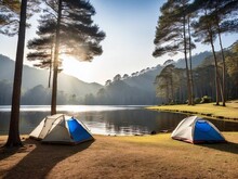 Camping Tents Under Pine Trees With Sunlight At Pang Ung Lake, Mae Hong Son In