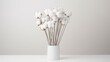 a bundle of cotton buds, showcasing their soft texture and delicate tips against a pure white backdrop.