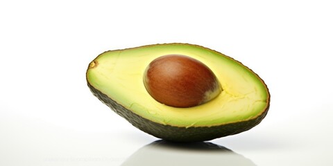 Poster - Avocado cut in half on a white surface. Perfect for healthy eating and food preparation concepts